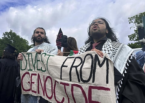 Pro-Palestian graduates leave an outdoor commencement at Massachusetts Institute of Technology in Cambridge.